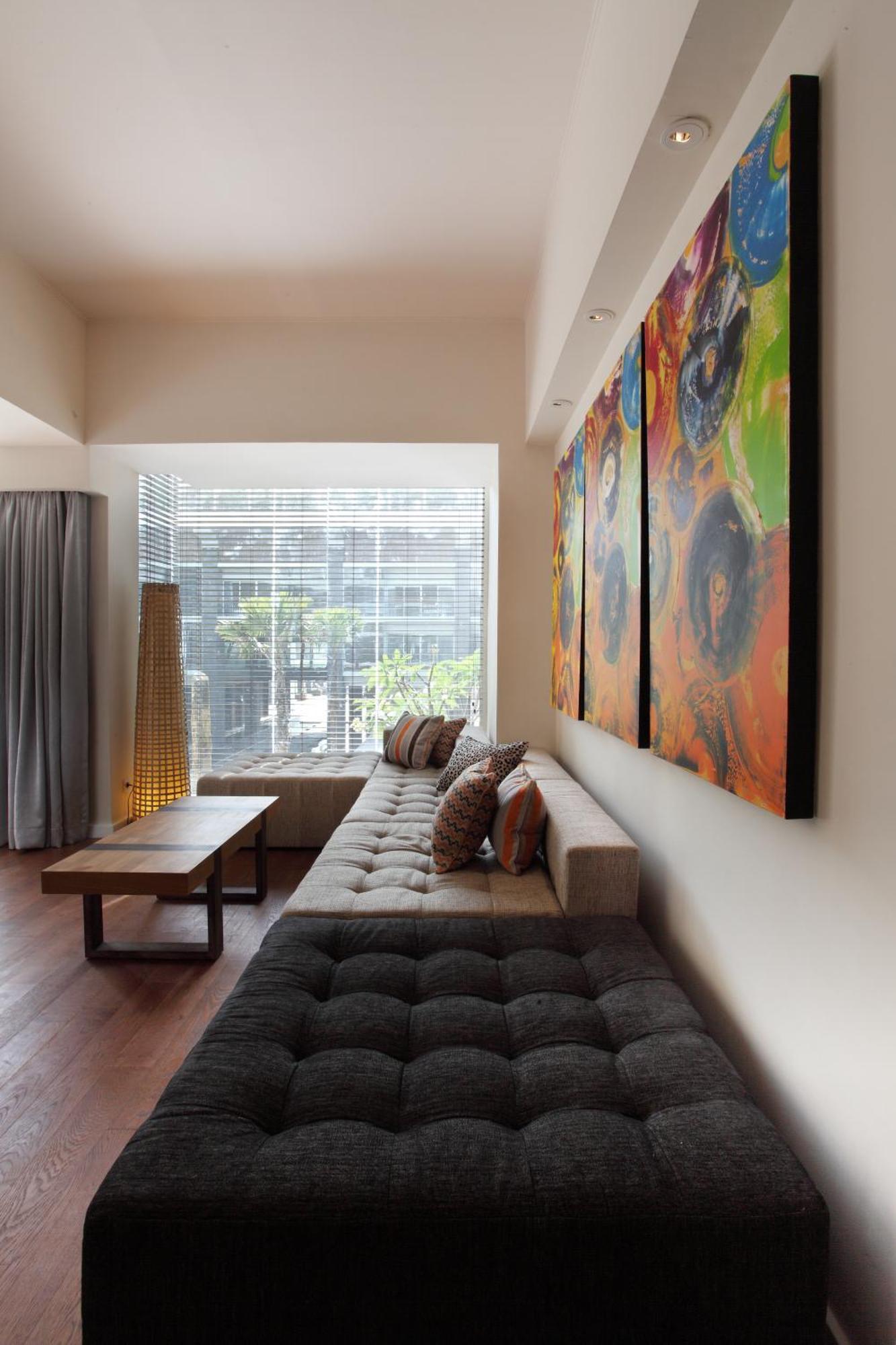 Ts Suites Seminyak  Room photo A living room with a sofa
